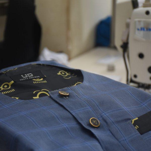 Embroidered UG crest on a corporate shirt